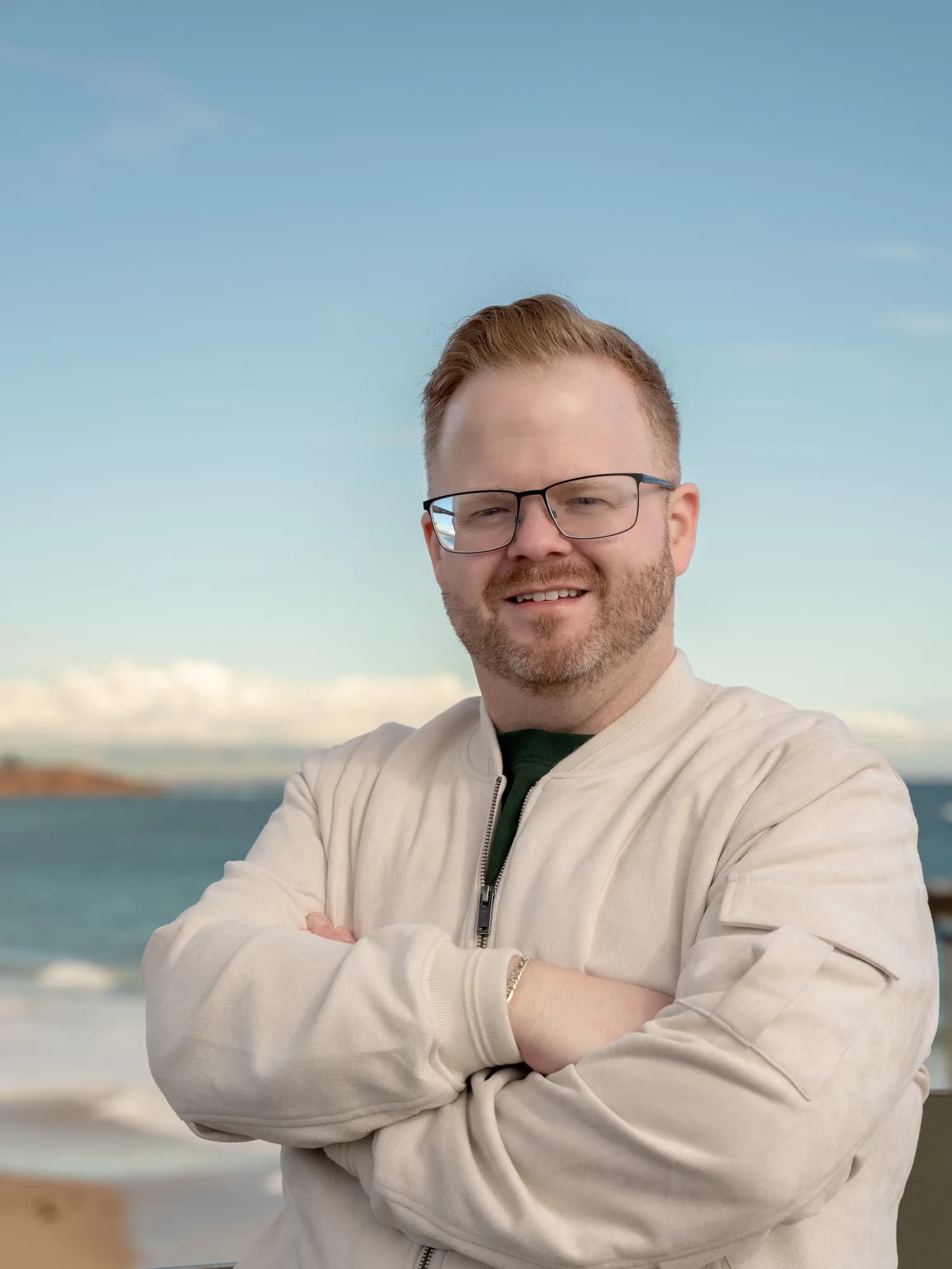 Portrait of Mark Lee, co-founder of Memory Lane Photography, by the coast